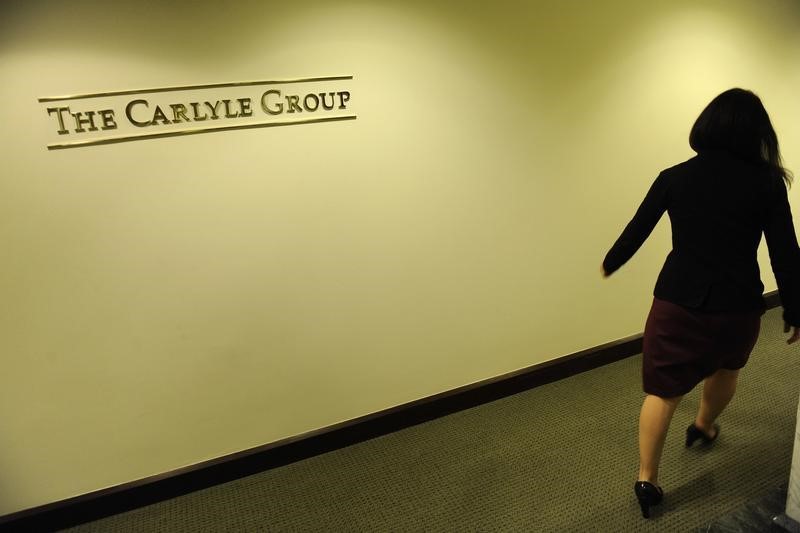 کاهش رتبه و هدف قیمتی سهام شرکت Carlyle Group